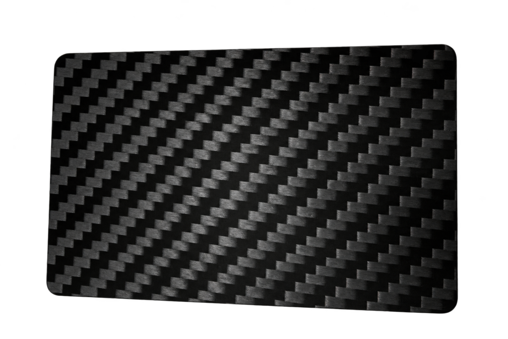 Black carbon fiber business card with a woven surface and rounded corners.